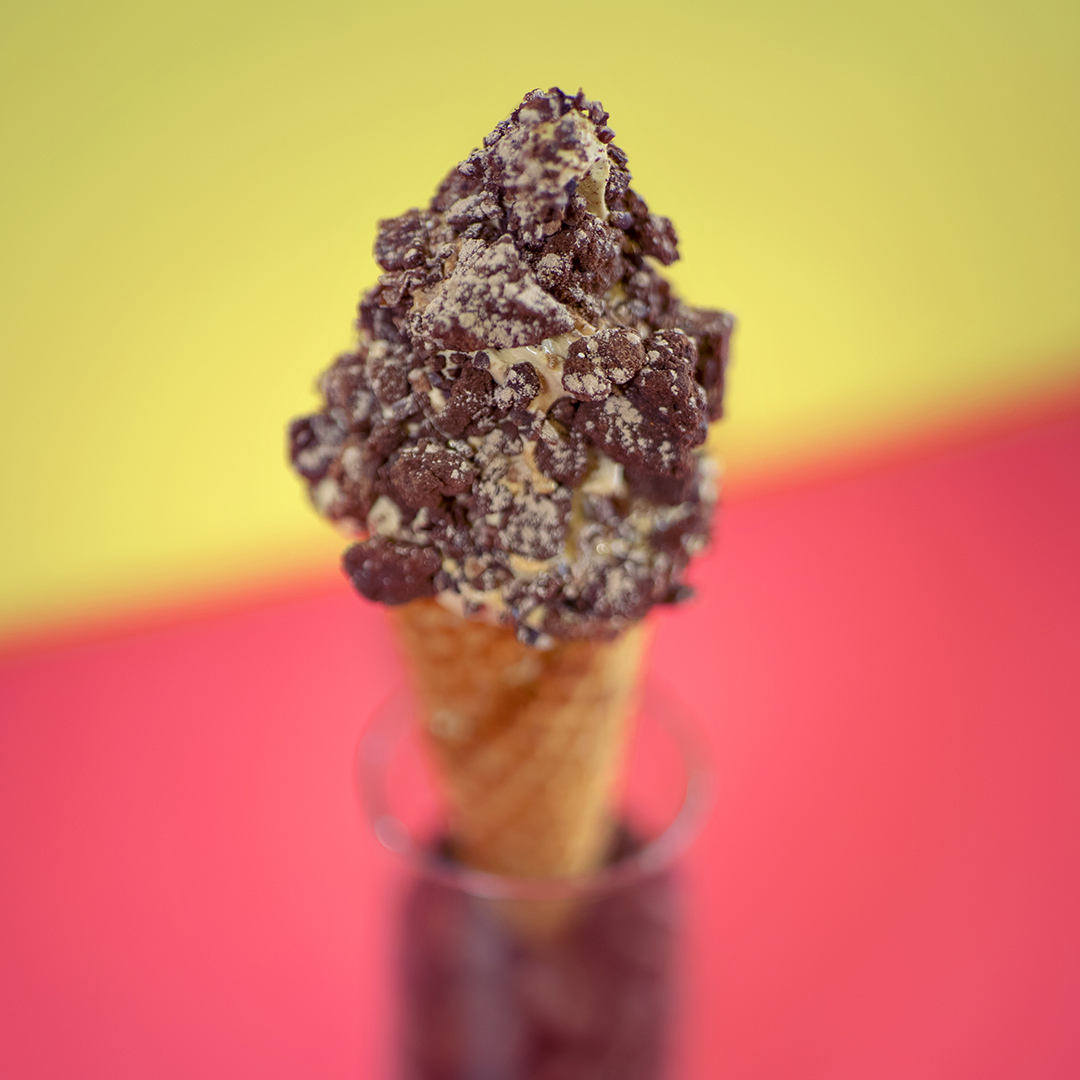 De la lloyd cone - chocolate soft serve with brownies and oreo crumbs